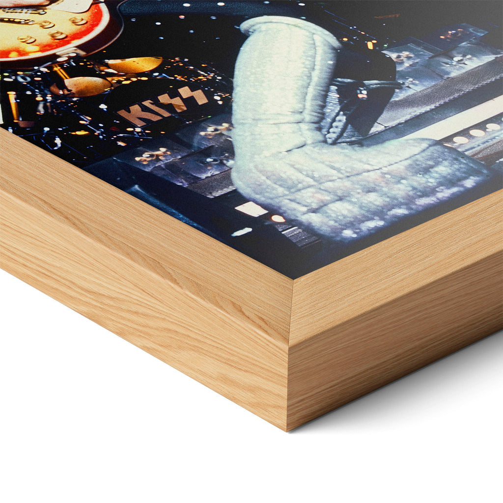 Corner close-up highlighting the natural oak finish of the framed Ace Frehley 1977 KISS color poster.