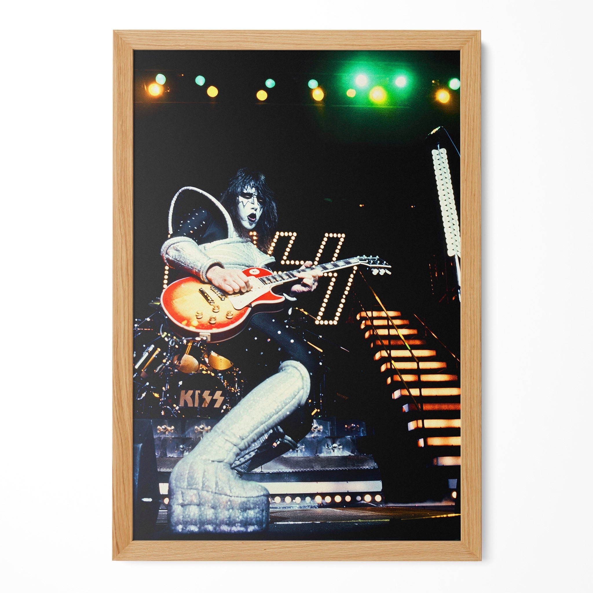 Ace Frehley 1977 KISS live color guitar poster in a premium natural oak wood frame by POSTEREVER.