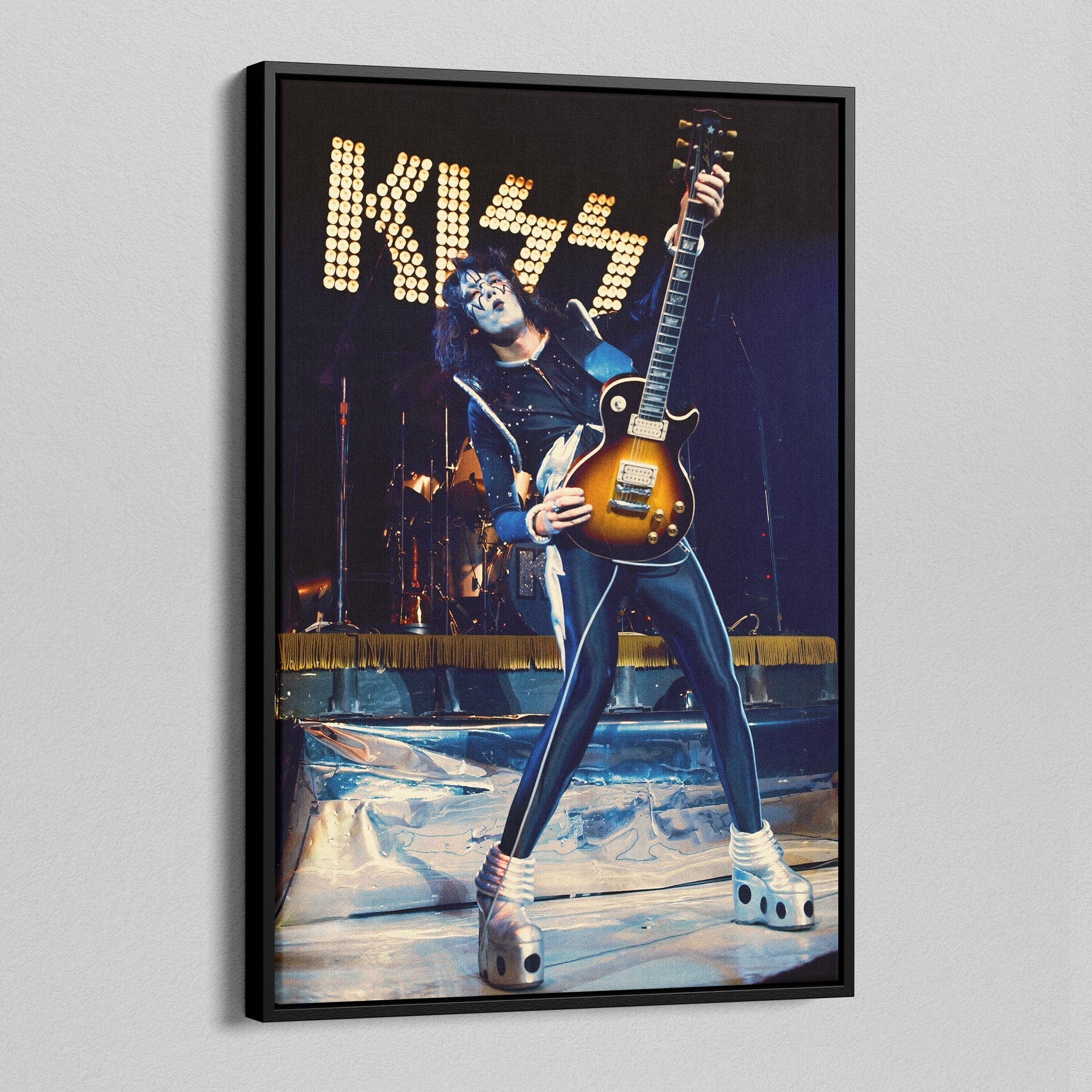 Side angle of the Ace Frehley 1977 KISS Japan color canvas in a luxury minimalist black floating frame.