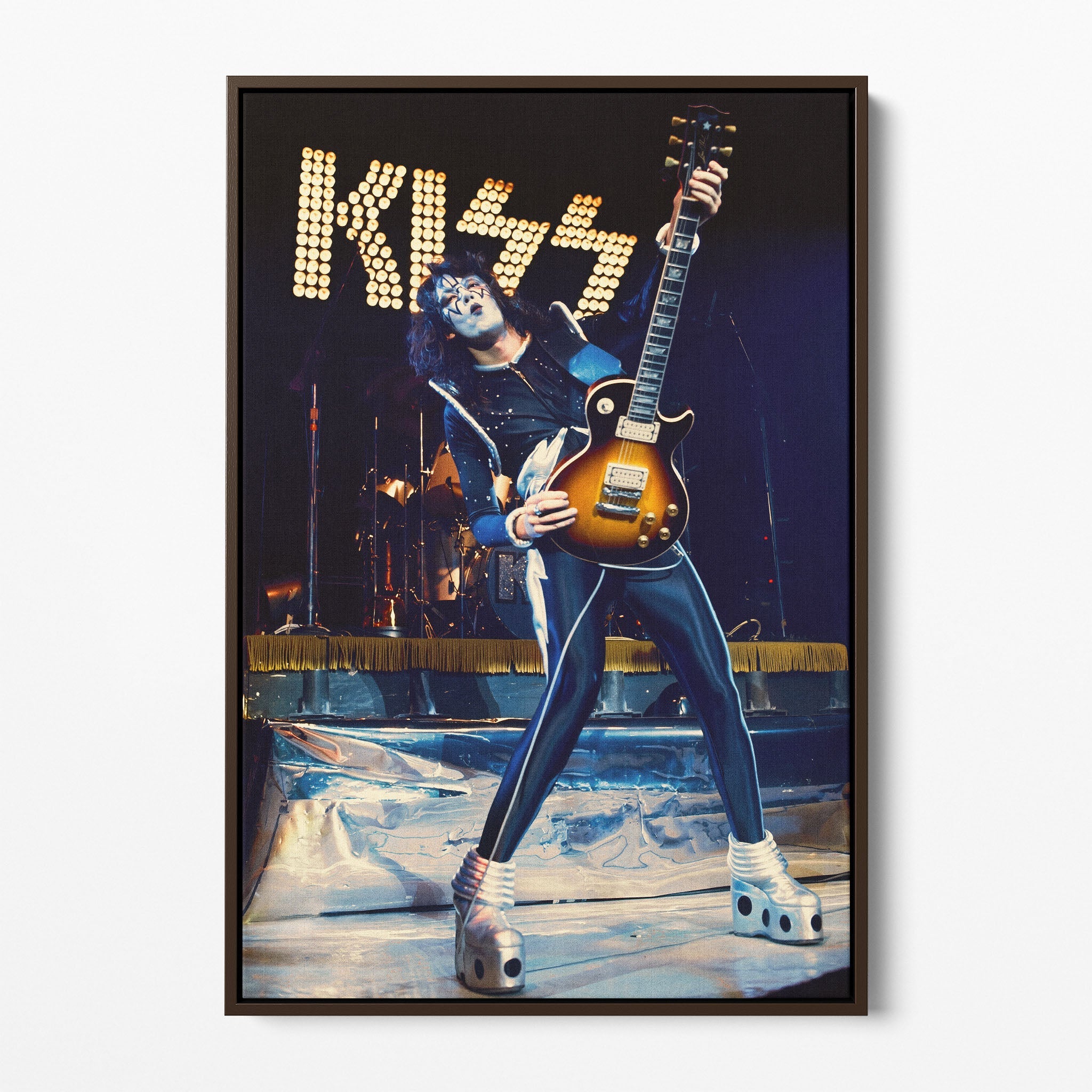 Front display of the Ace Frehley 1977 KISS Japan color canvas in a premium dark walnut floating frame.