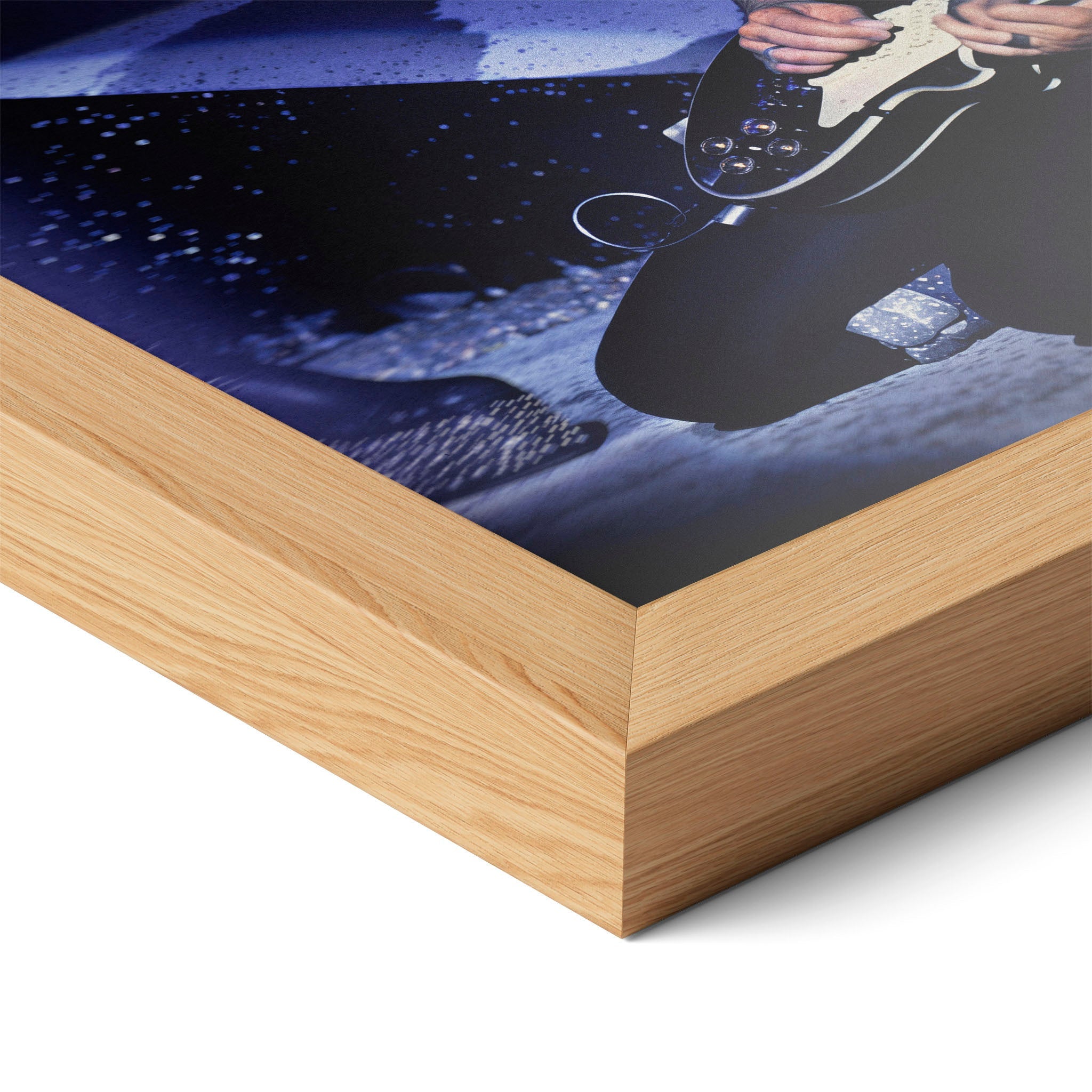 Corner close-up highlighting the natural oak finish of the framed Ace Frehley 1979 KISS Dynasty color poster.