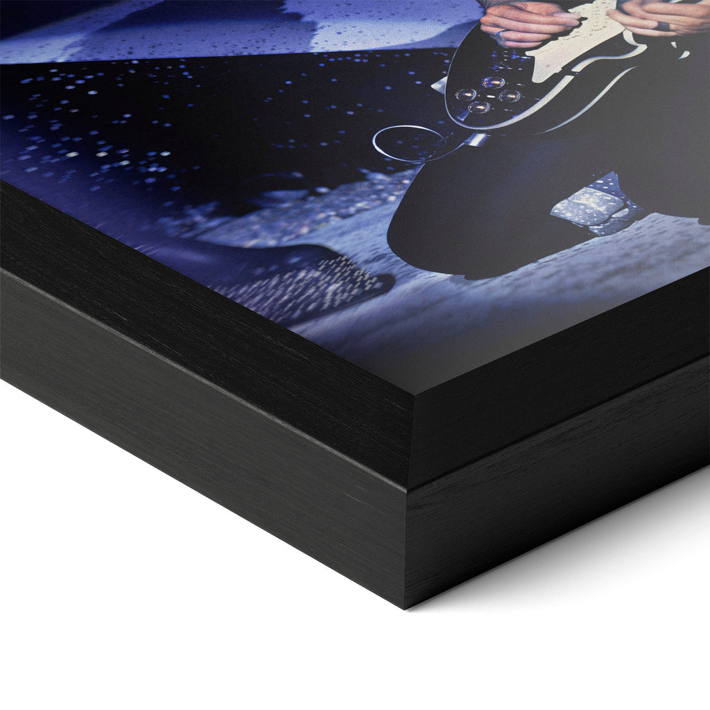 Detailed corner close-up of the premium black wooden frame holding the Ace Frehley 1979 KISS color rock poster.