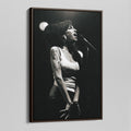Angled view of the Amy Winehouse 2007 black and white canvas in a sophisticated dark walnut floating frame.