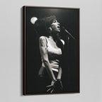 Angled view of the Amy Winehouse 2007 black and white canvas in a sophisticated dark walnut floating frame.