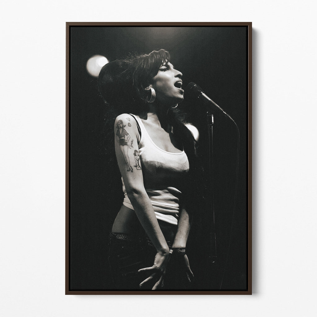 Front display of the Amy Winehouse 2007 black and white canvas in a premium dark walnut floating frame.