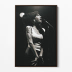 Front display of the Amy Winehouse 2007 black and white canvas in a premium dark walnut floating frame.