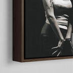 Corner close-up showing the rich grain and joinery of the dark walnut floating canvas frame.