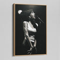 Angled view of the black and white canvas in a modern natural oak wood floating frame.