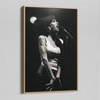 Angled view of the black and white canvas in a modern natural oak wood floating frame.