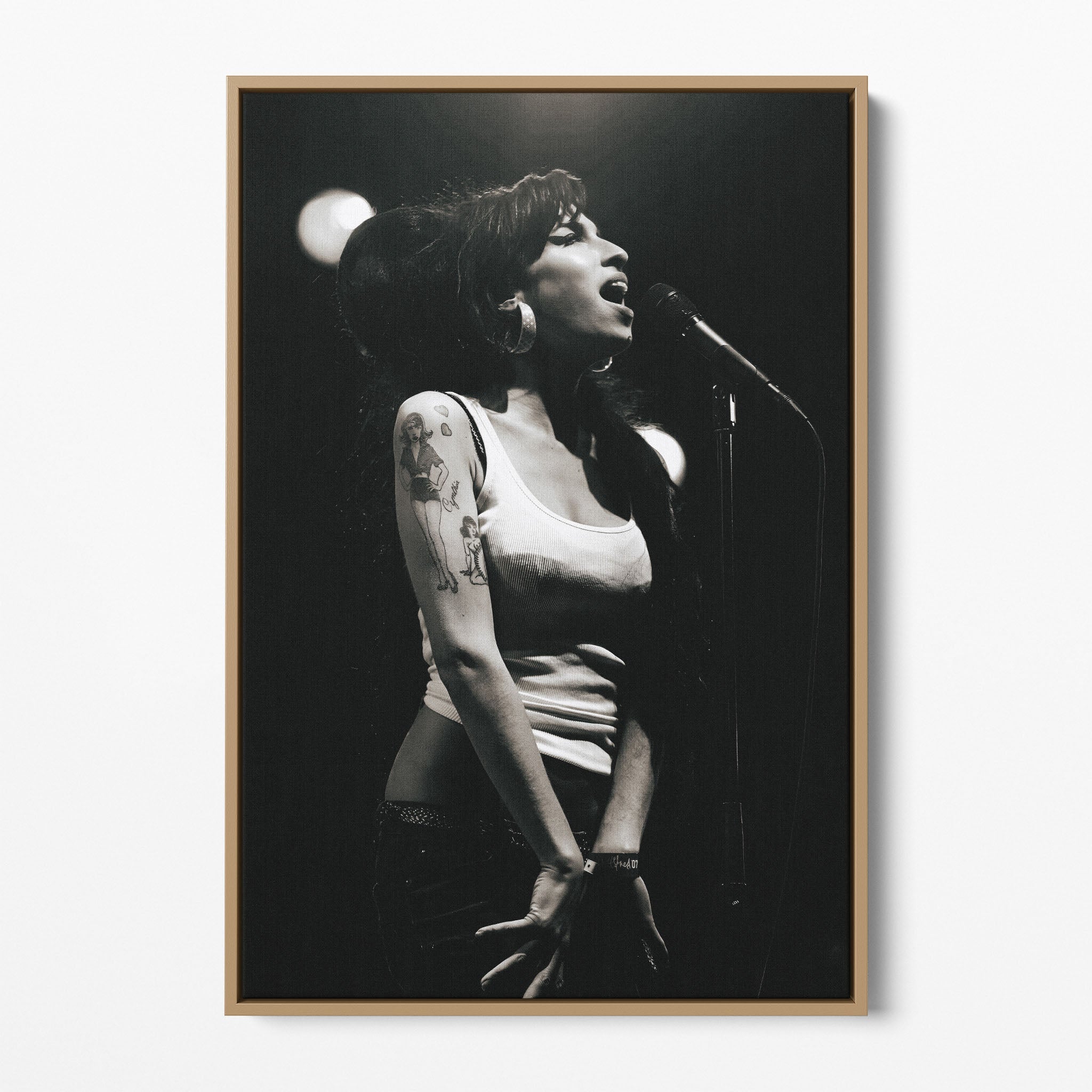 Front display of the Amy Winehouse 2007 black and white canvas in a premium natural wood floating frame.