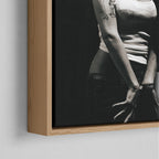 Corner close-up of the floating gap and grain texture of the natural wood canvas frame.
