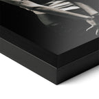 Detailed corner close-up of the premium black wooden frame holding the Amy Winehouse 2007 black and white portrait poster.