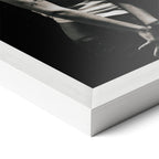 Corner close-up revealing the clean wood grain of the white framed Amy Winehouse 2007 black and white art print.