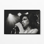 Front view of the Amy Winehouse 2007 black and white canvas in a sleek black floating frame.