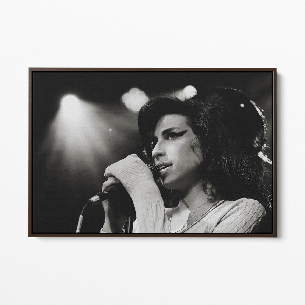 Front display of the Amy Winehouse 2007 black and white canvas in a premium dark walnut floating frame.