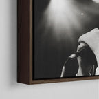 Corner close-up showing the rich grain and joinery of the dark walnut floating canvas frame.