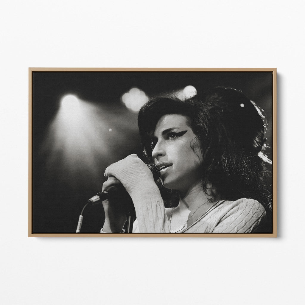 Front display of the Amy Winehouse 2007 black and white canvas in a premium natural wood floating frame.
