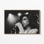 Front display of the Amy Winehouse 2007 black and white canvas in a premium natural wood floating frame.