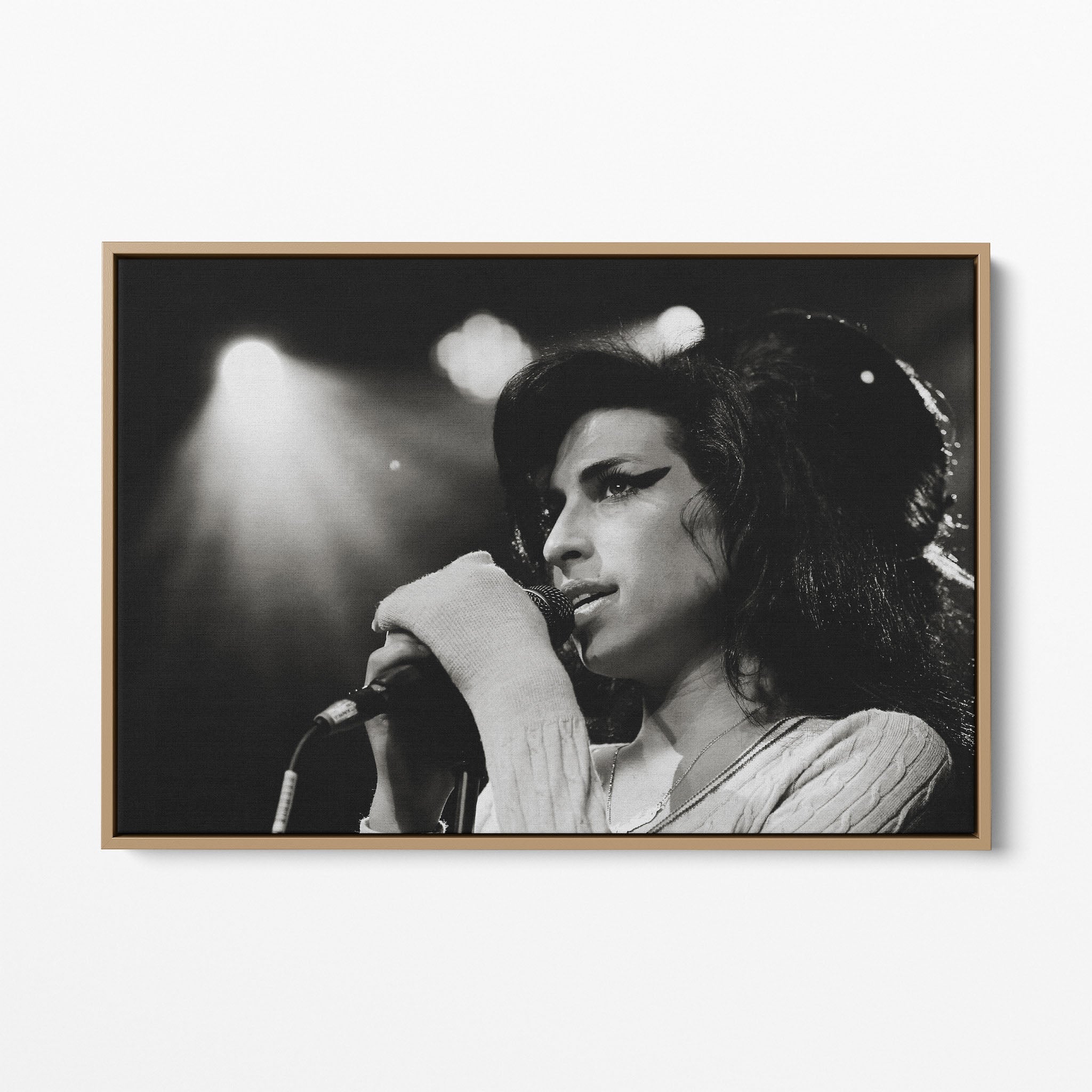 Front display of the Amy Winehouse 2007 black and white canvas in a premium natural wood floating frame.