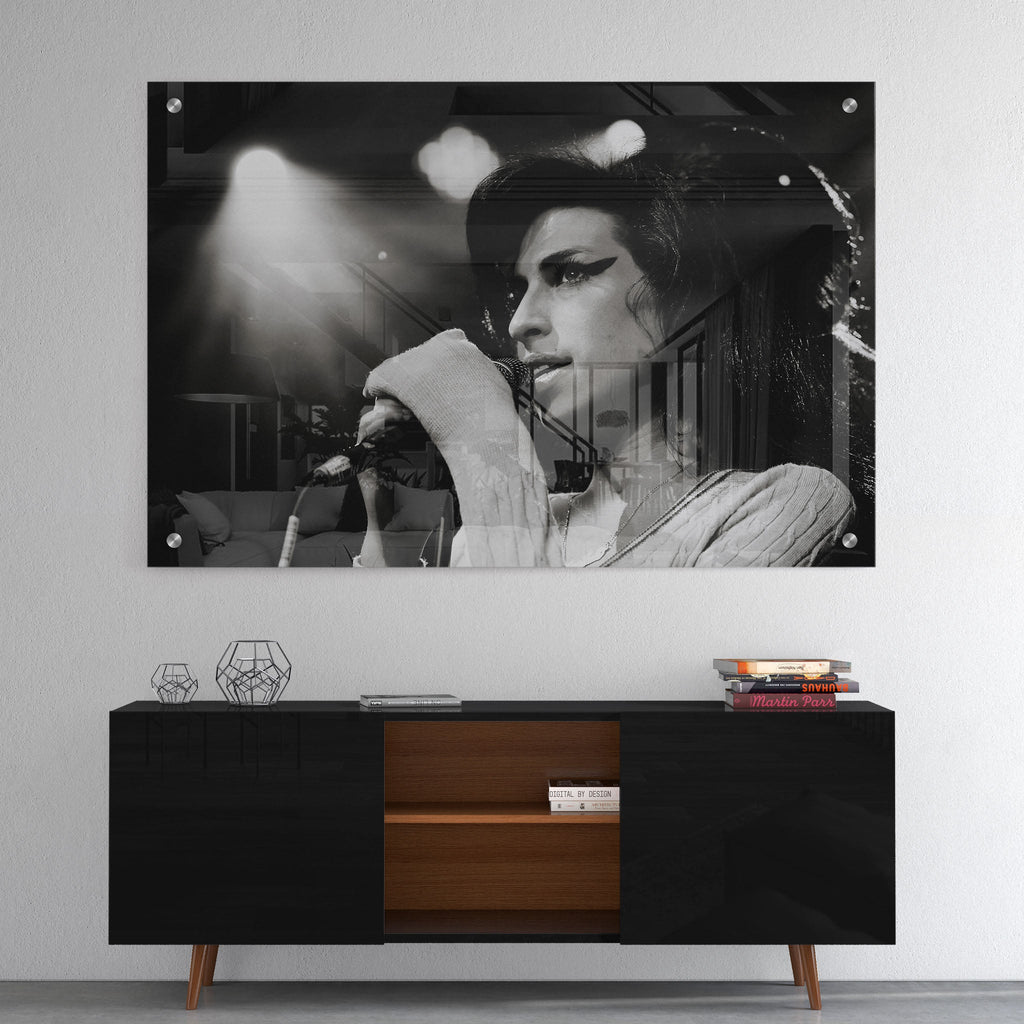 High-gloss acrylic glass black and white print of Amy Winehouse displayed above a contemporary console.