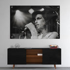 High-gloss acrylic glass black and white print of Amy Winehouse displayed above a contemporary console.