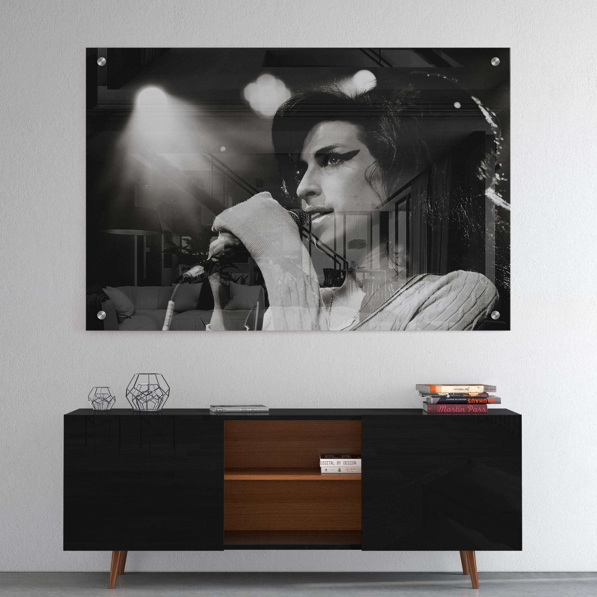 High-gloss acrylic glass black and white print of Amy Winehouse displayed above a contemporary console.