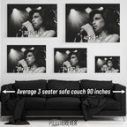 Amy Winehouse 2007 Zurich black and white wall art size comparison chart shown above an average 90-inch three-seater sofa.