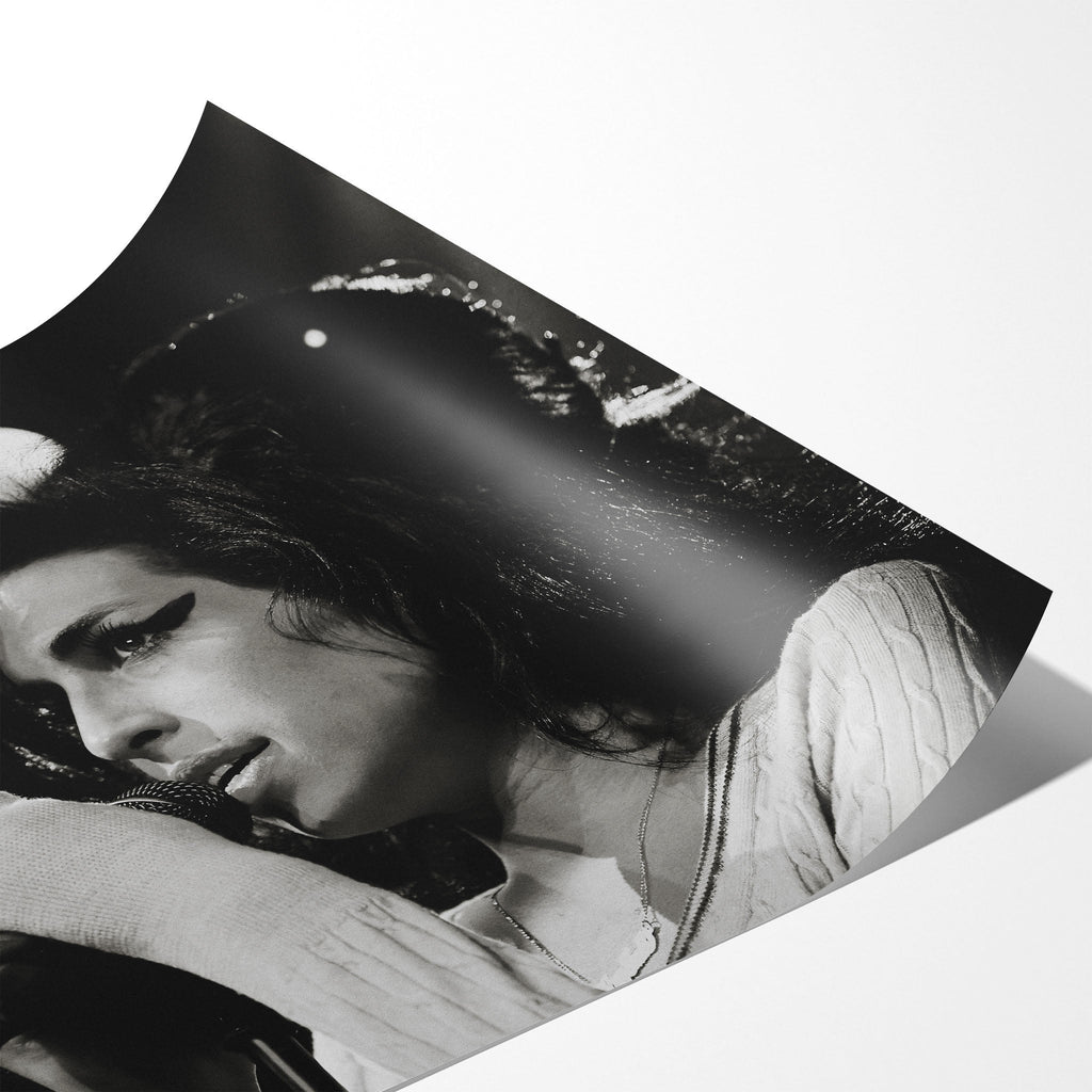 Angled close-up of the unframed premium matte black and white Amy Winehouse 2007 Zurich poster print.