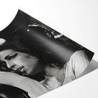 Angled close-up of the unframed premium matte black and white Amy Winehouse 2007 Zurich poster print.