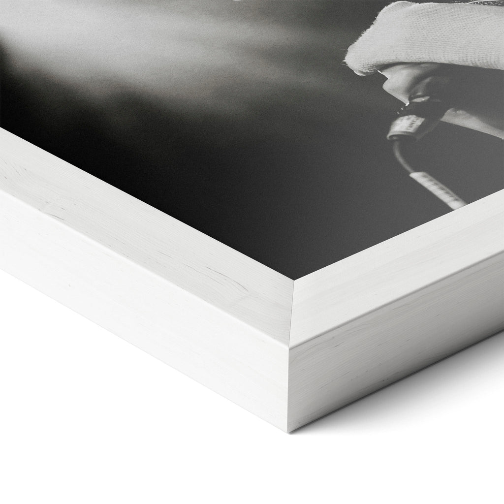 Corner close-up revealing the clean wood grain of the white framed Amy Winehouse 2007 black and white art print.