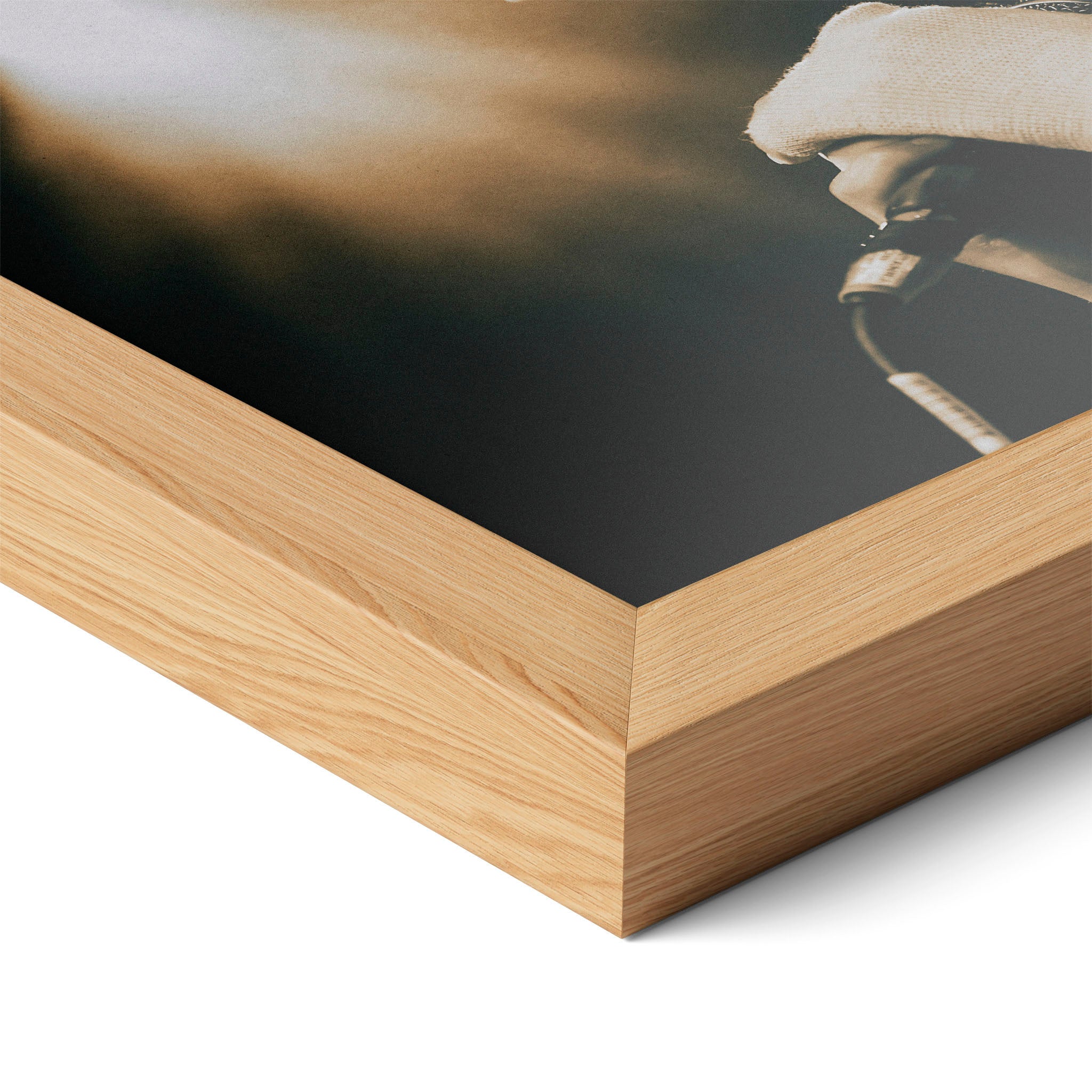Corner close-up highlighting the natural oak finish of the framed Amy Winehouse 2007 color poster.