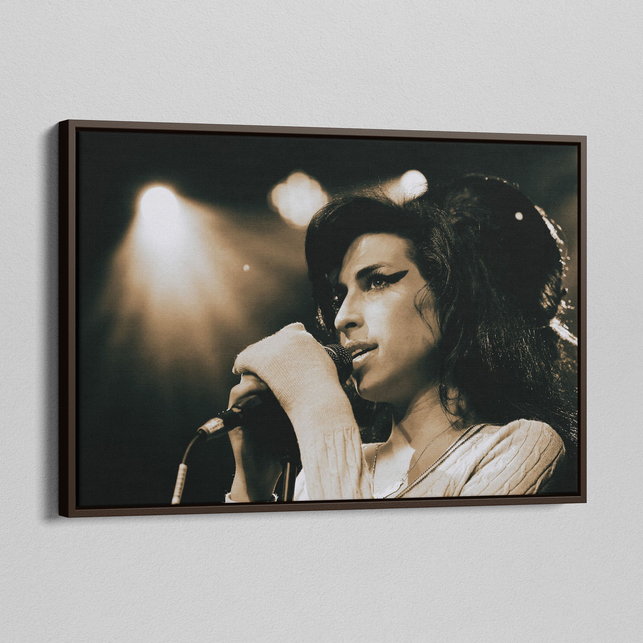 Angled view of the Amy Winehouse 2007 color canvas in a sophisticated dark walnut floating frame.