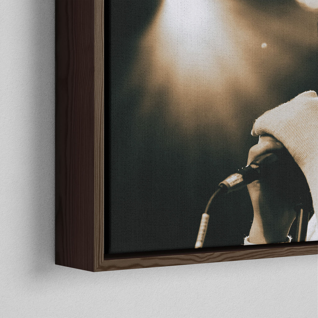 Corner close-up showing the rich grain and joinery of the dark walnut floating canvas frame.