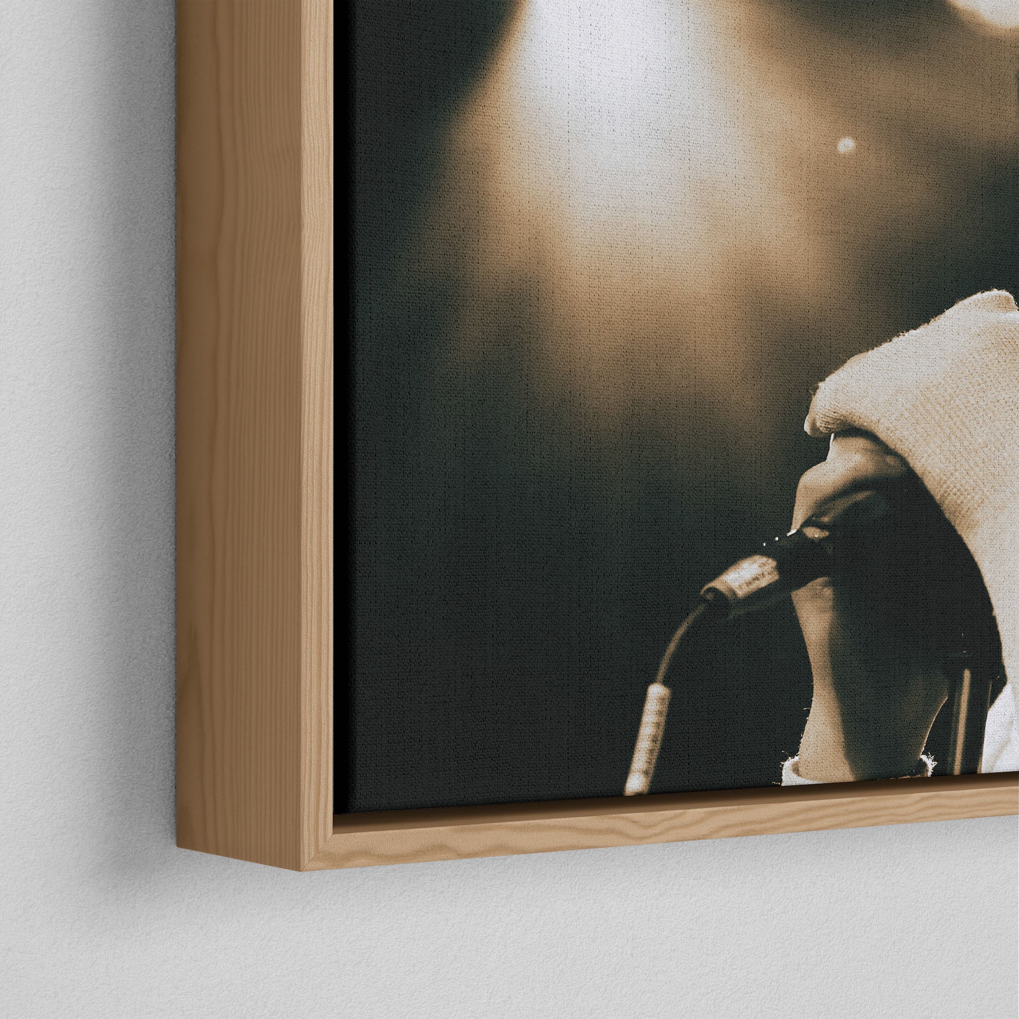 Corner close-up of the floating gap and grain texture of the natural wood canvas frame.