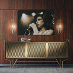 Sleek aluminum color metal print of Amy Winehouse displayed over a mid-century modern credenza.