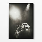Front view of the Amy Winehouse black and white canvas in a sleek black floating frame.