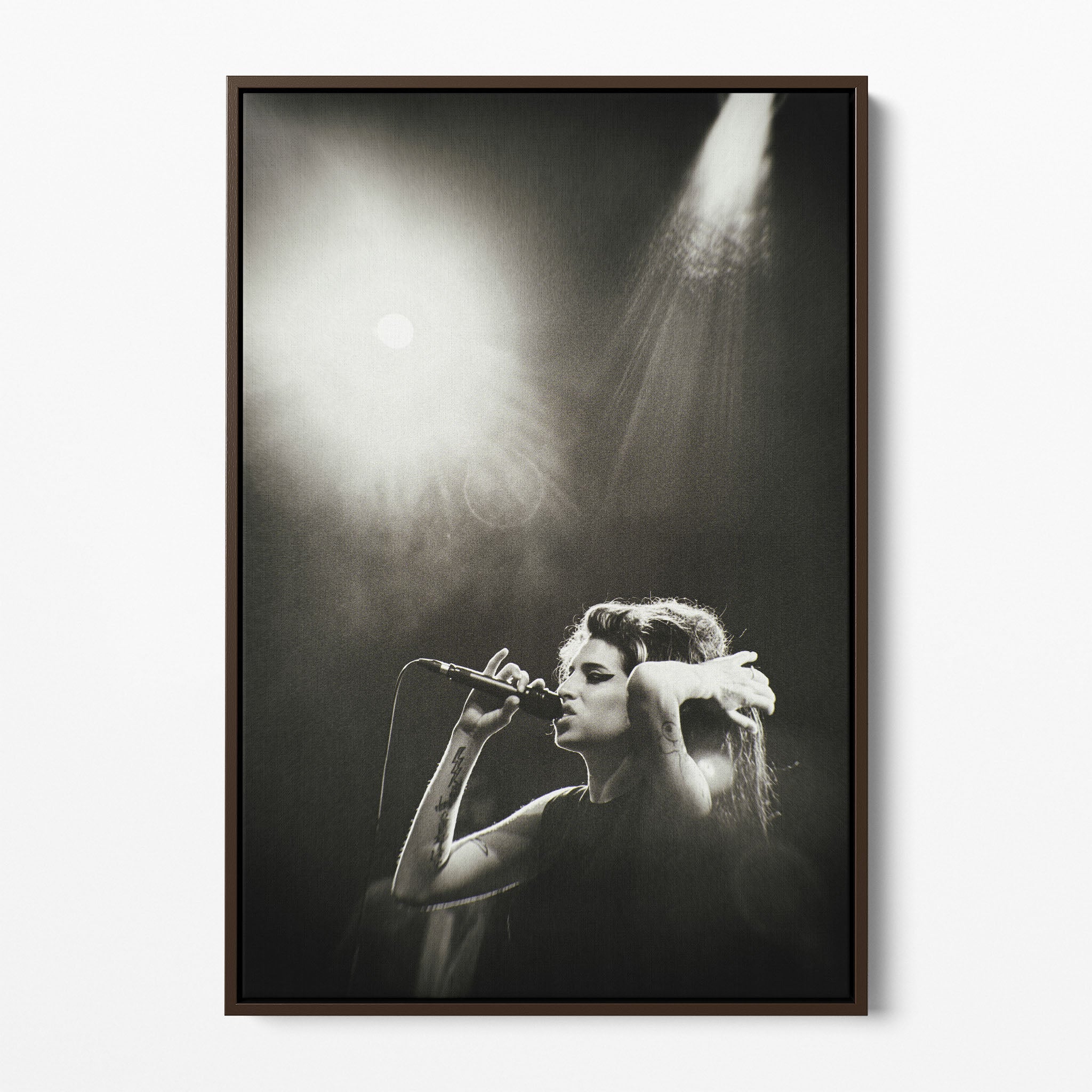 Front display of the Amy Winehouse black and white canvas in a premium dark walnut floating frame.