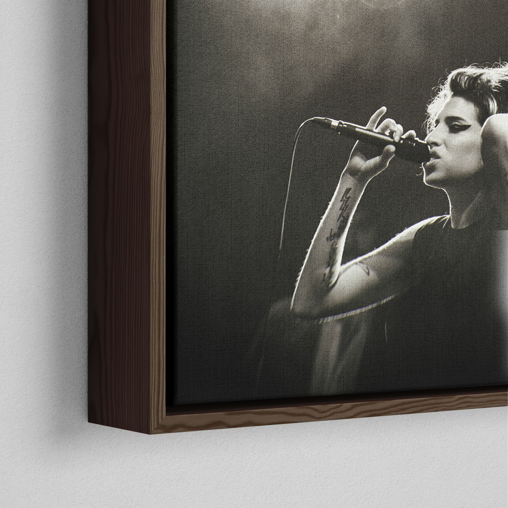 Corner close-up showing the rich grain and joinery of the dark walnut floating canvas frame.