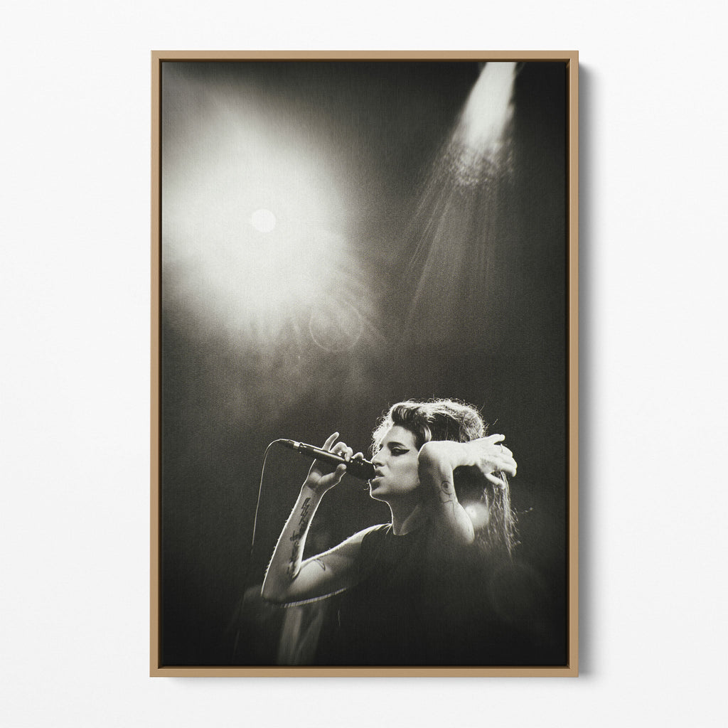 Front display of the Amy Winehouse black and white canvas in a premium natural wood floating frame.