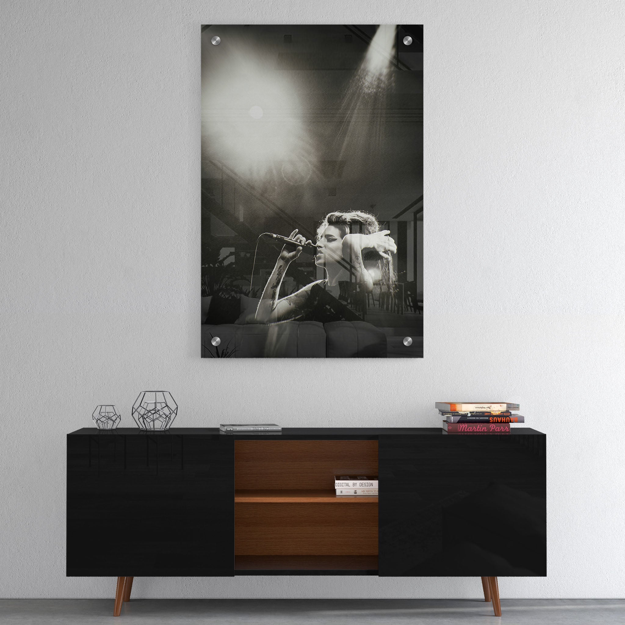 High-gloss acrylic glass black and white print of Amy Winehouse displayed above a contemporary console.
