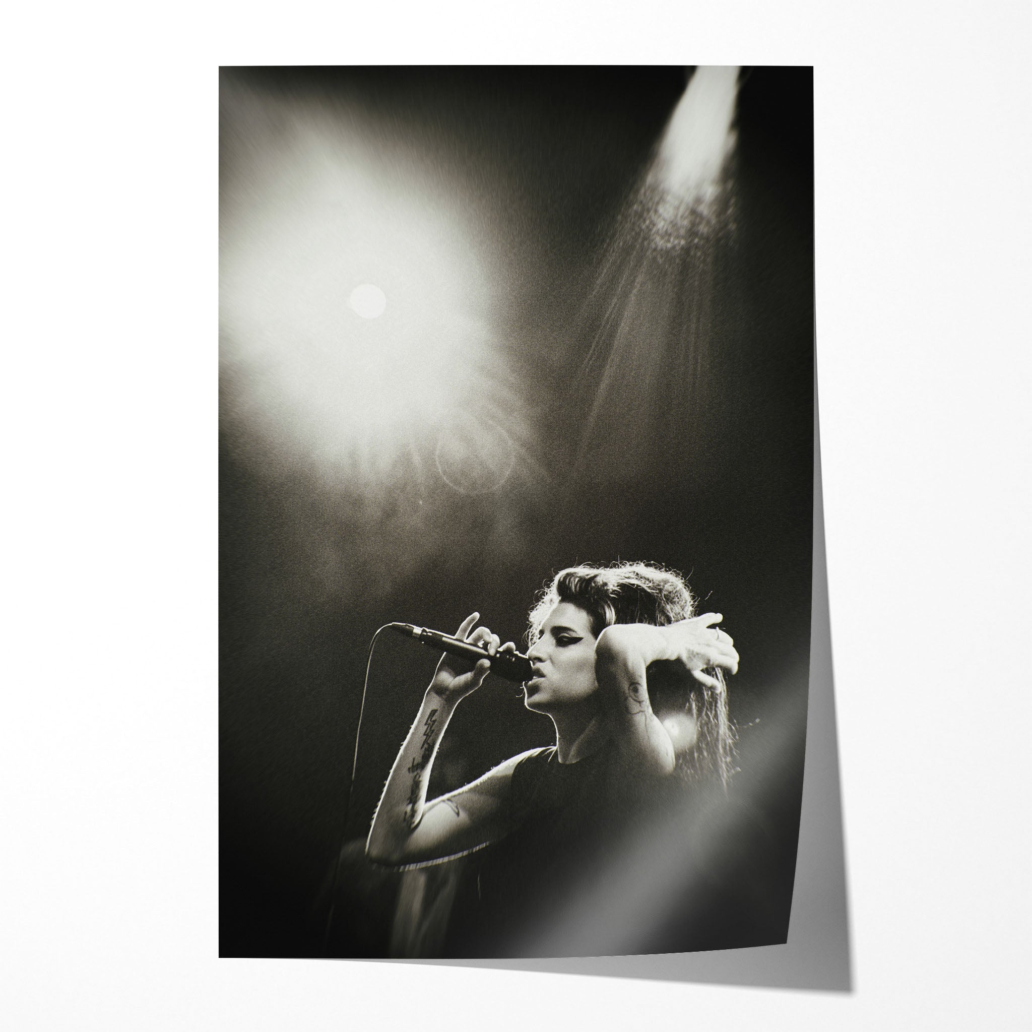 Unframed black and white Amy Winehouse Back to Black era live concert poster print with her signature beehive and cat-eye under spotlights.