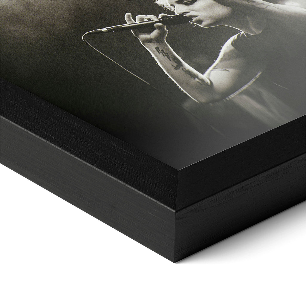 Detailed corner close-up of the premium black wooden frame holding the Amy Winehouse black and white concert poster.
