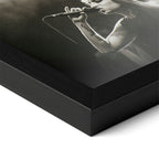 Detailed corner close-up of the premium black wooden frame holding the Amy Winehouse black and white concert poster.