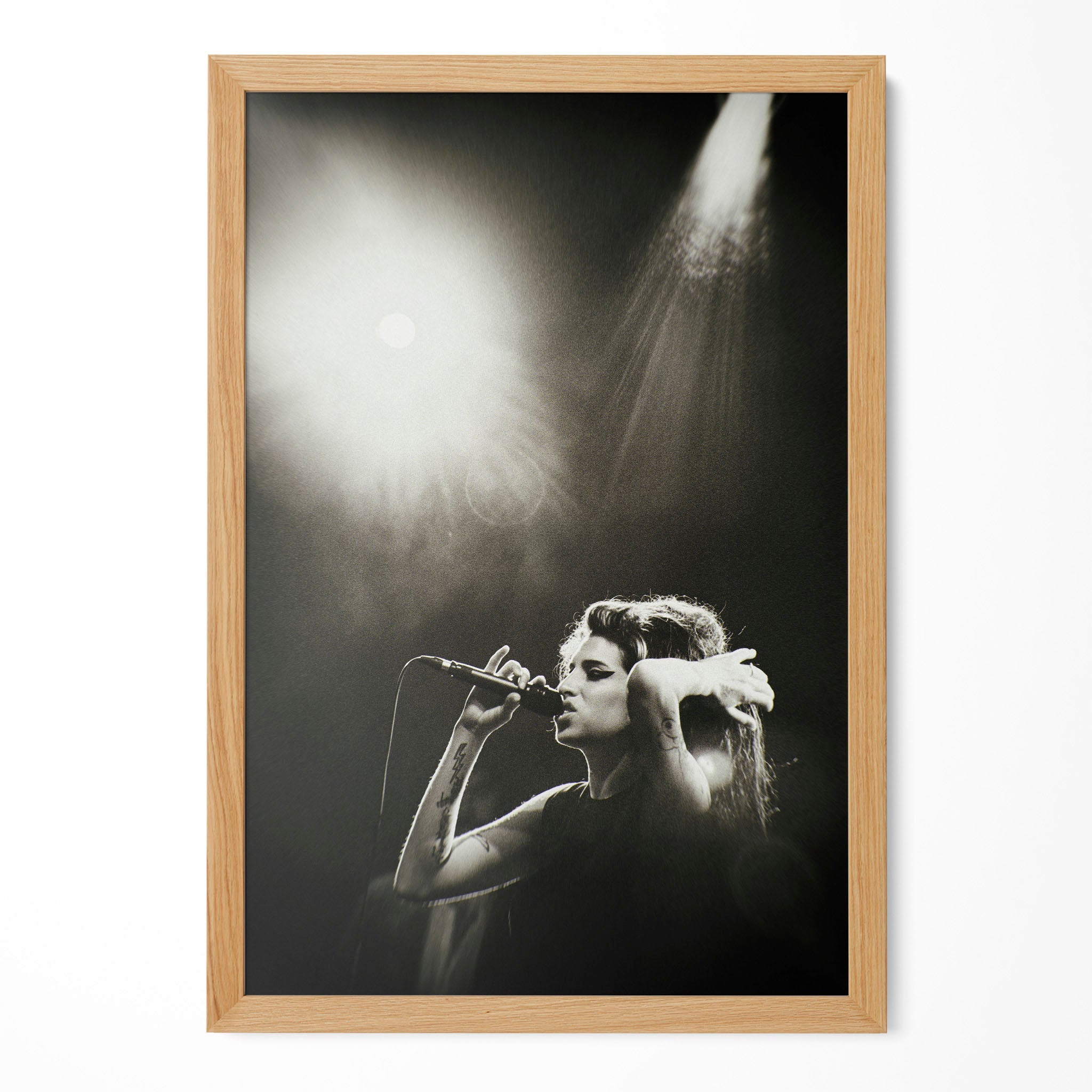 Amy Winehouse Back to Black era black and white poster in a premium natural oak wood frame by POSTEREVER.