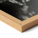 Corner close-up highlighting the natural oak finish of the framed Amy Winehouse 2008 Grammys black and white poster.