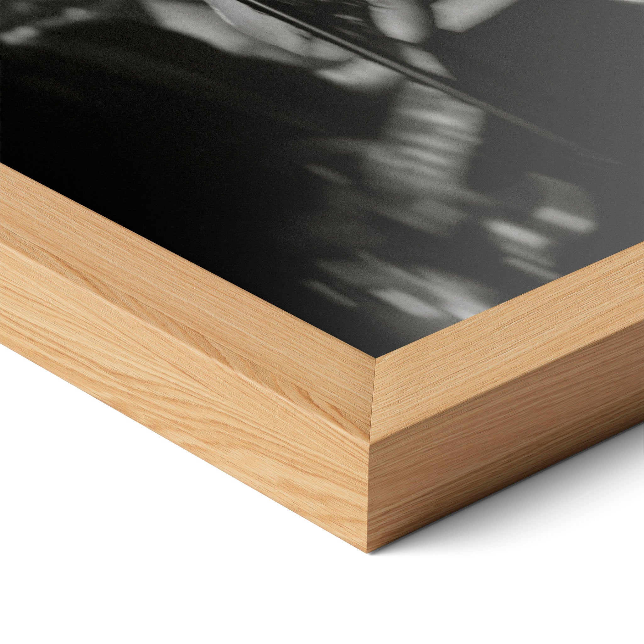Corner close-up highlighting the natural oak finish of the framed Amy Winehouse 2008 Grammys black and white poster.