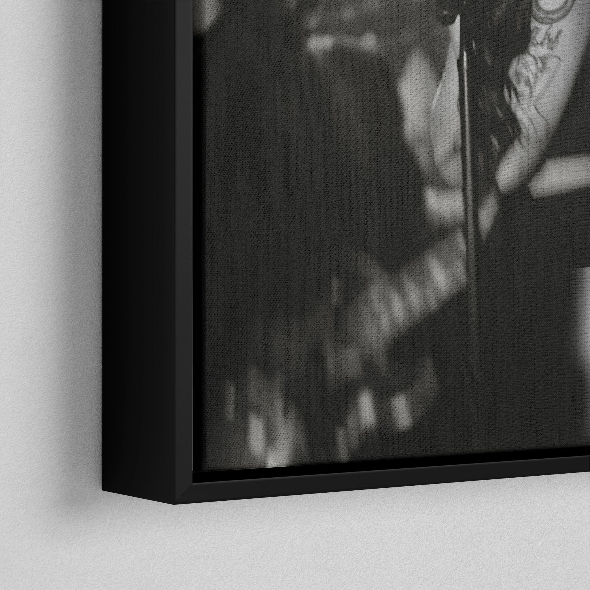 Corner macro of the elegant floating gap and fine finish of the black floating canvas frame.
