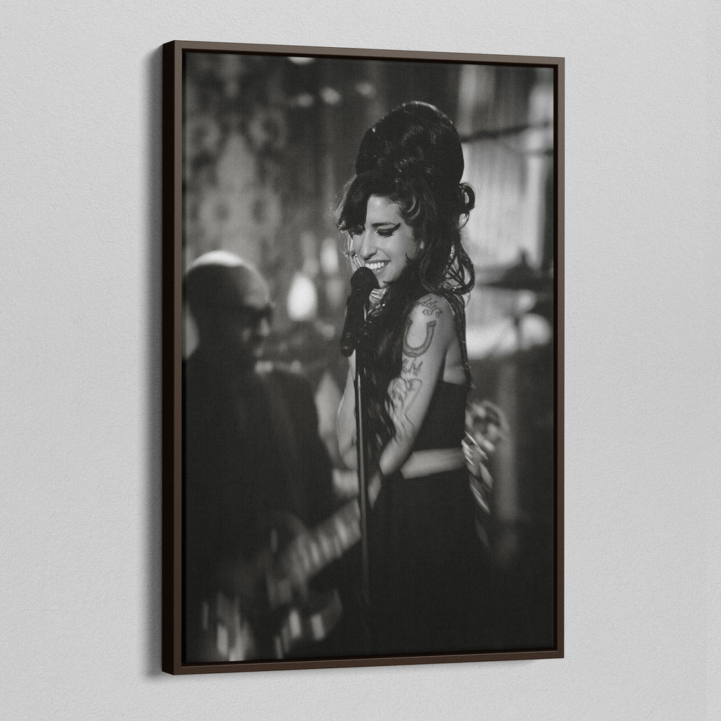 Angled view of the Amy Winehouse 2008 Grammys black and white canvas in a sophisticated dark walnut floating frame.