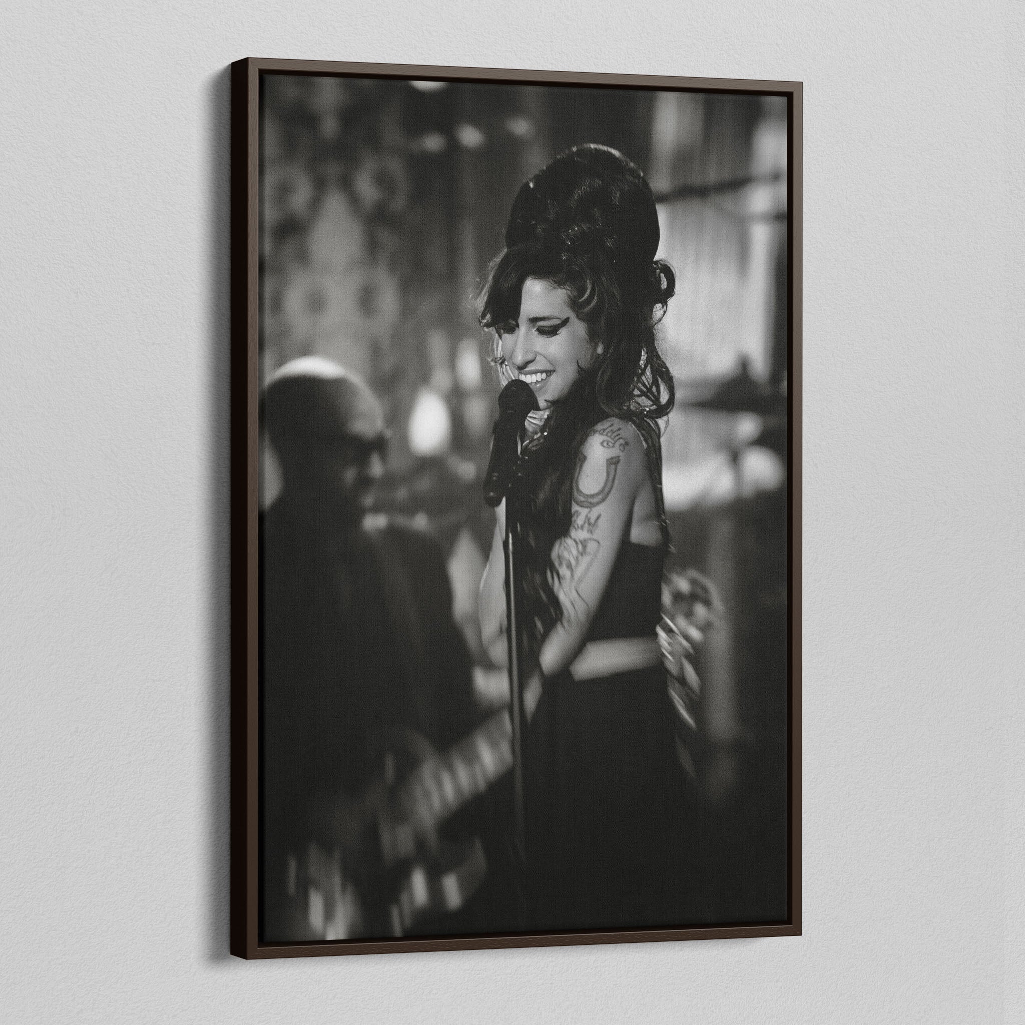 Angled view of the Amy Winehouse 2008 Grammys black and white canvas in a sophisticated dark walnut floating frame.