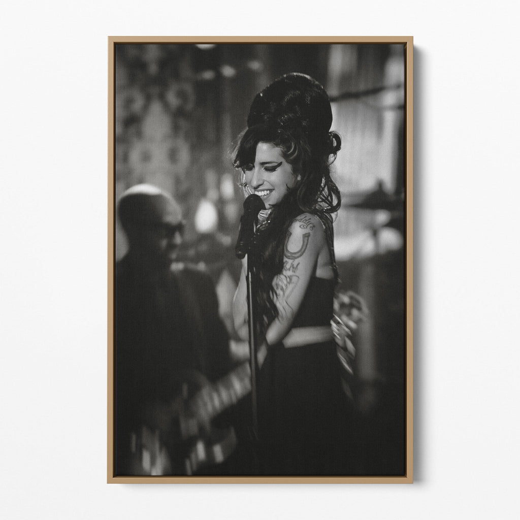 Front display of the Amy Winehouse 2008 Grammys black and white canvas in a premium natural wood floating frame.